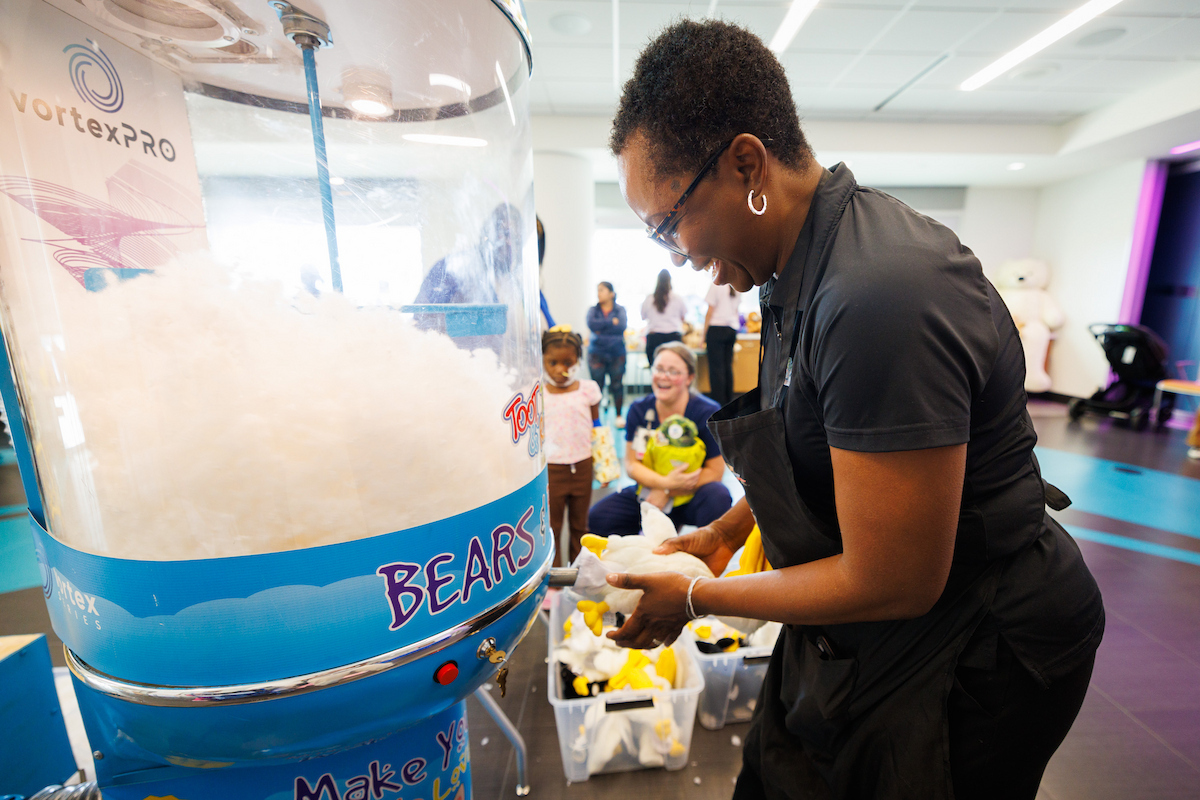 Andrea Jones-Davis, owner-founder of Toot, Teach and Roll, stuffs a pelican during Toot, Teach and Roll's third annual Furry Friends event at the children's hospital.